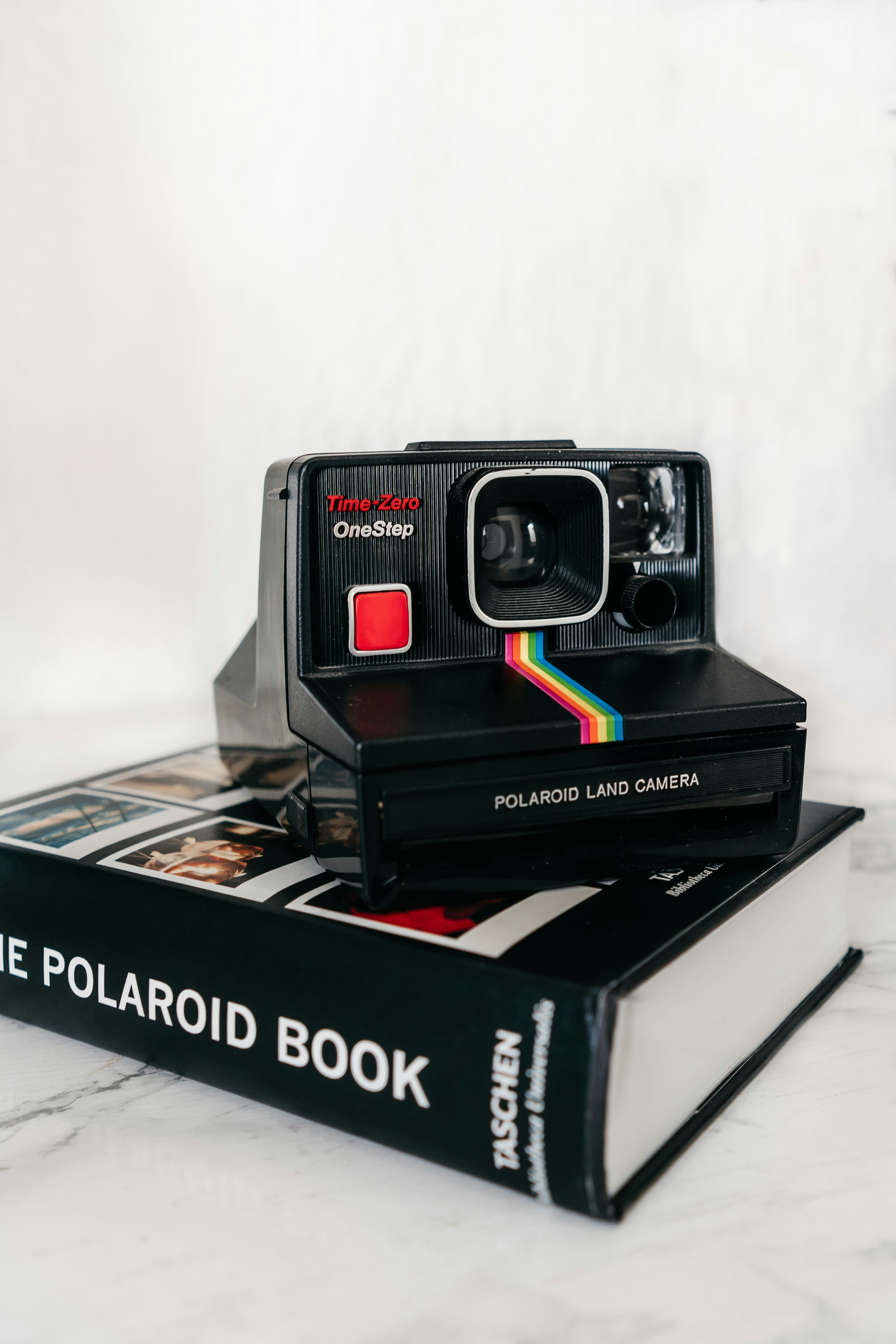red and black polaroid camera